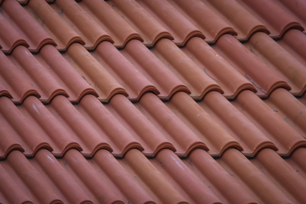 Close-up of concrete roof tiles after new underlayment was installed